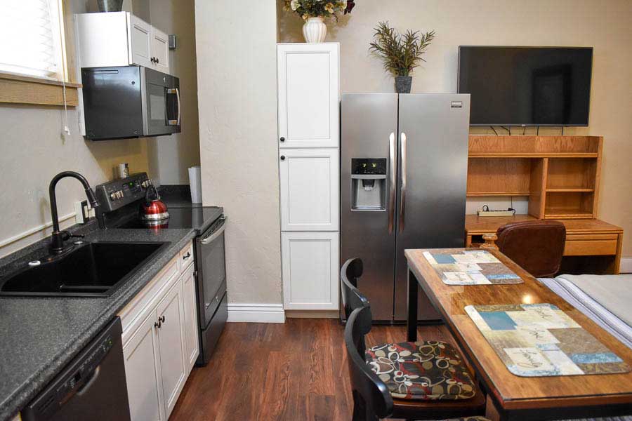 Comfort Studio with Kitchenette, Bistro Table, Desk and Refrigerator